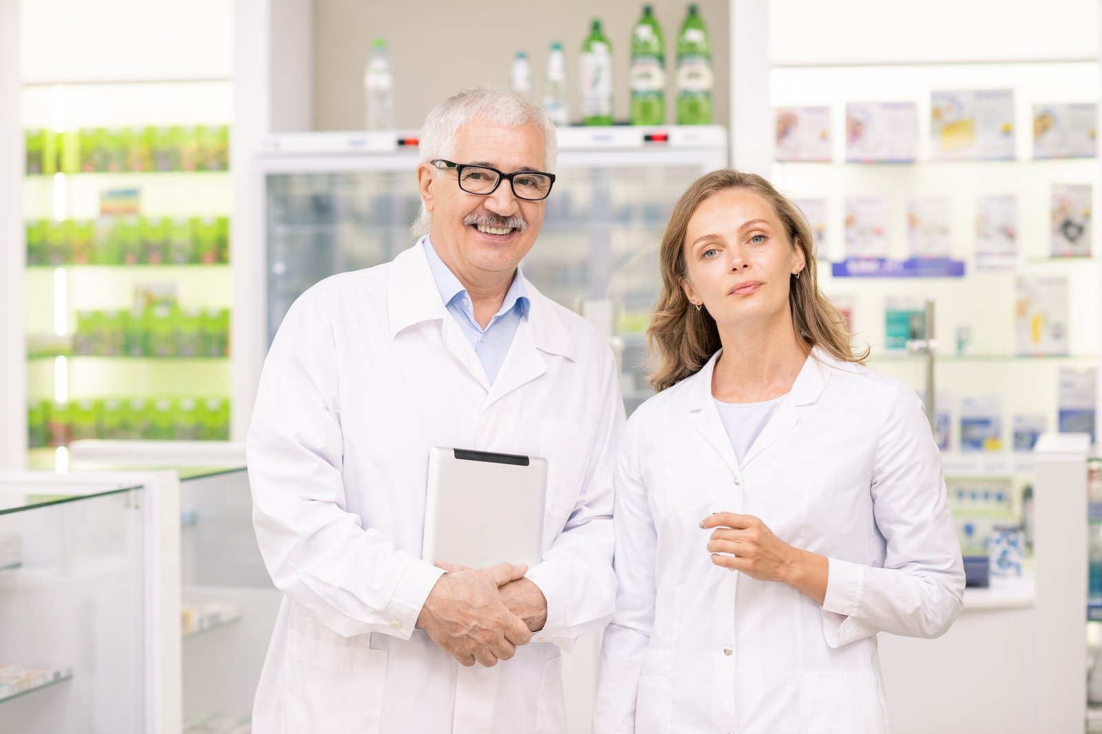 pretty-blond-female-pharmacist-and-her-senior-colleague-in-whitecoats.jpg pretty-blond-female-pharmacist-and-her-senior-colleague-in-whitecoats.jpg